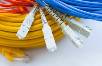 fiber phone and category cables in a pile