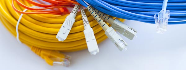 fiber phone and category cables in a pile